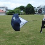 functional fitness-running with parachute for resistance