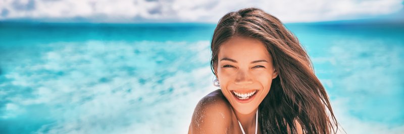Beautiful woman smiling on beach