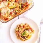Vegetarian Pasta Bake with roasted vegetables served on a white plate