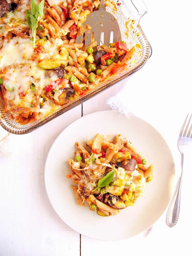 Vegetarian Pasta Bake with roasted vegetables served on a white plate