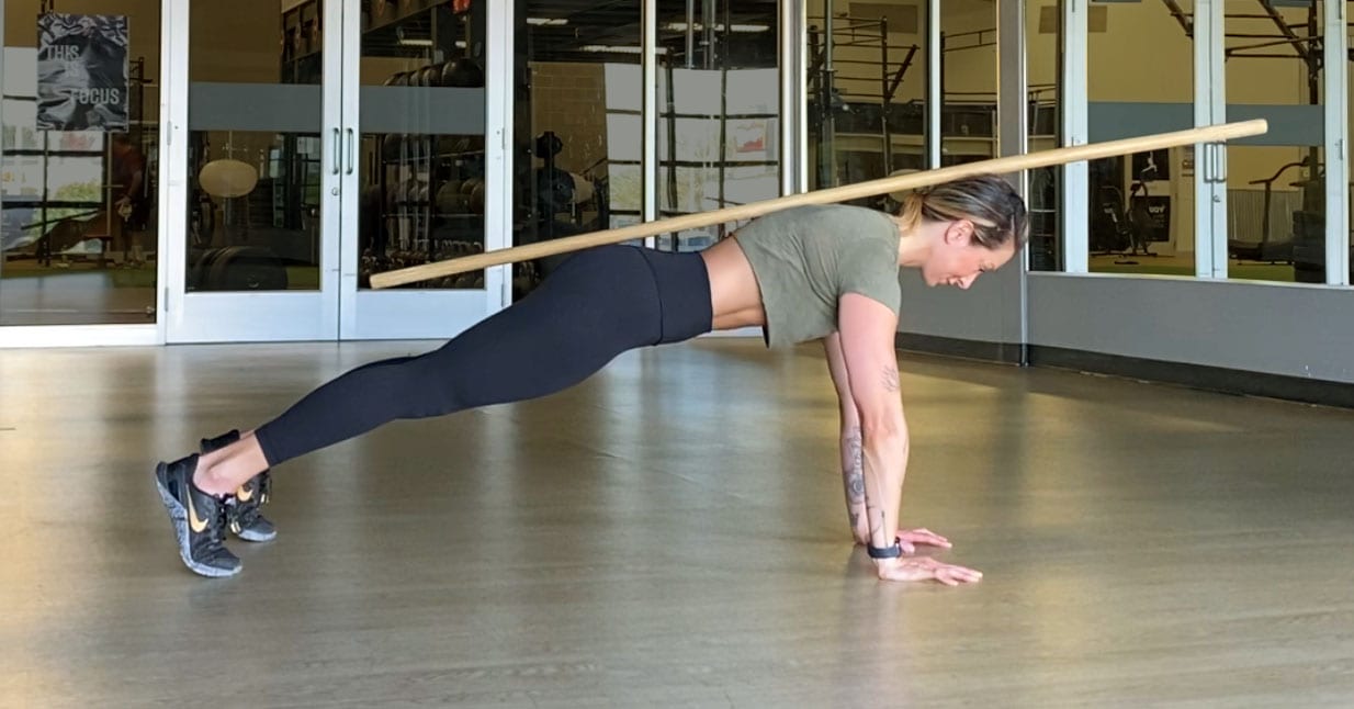 Jen Comas demonstrates proper alignment in the starting position of a push-up