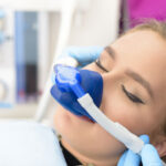 a dental implant patient during an inhaled sedation procedure