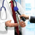 doctor-talking-to-microphone_18556352024_o