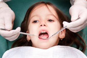 child having dental exam