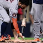 Jose Altuve tossed for removing cleat, sock in wild Astros win