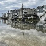 Flooding at midday high tide on Saturday at 57th Street and Sounds Avenue near the bay in Sea Isle City.