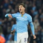 Manchester City's John Stones celebrates scoring on September 22, 2024