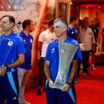 Olympiacos manager Jose Luis Mendilibar holds the Conference League trophy before his side's pre-season game against Nottingham Forest on August 8, 2024