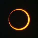 a ring of orange against a black background.