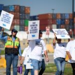 Striking port workers to return to work Friday as negotiators reach an agreement on wages