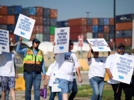 Striking port workers to return to work Friday as negotiators reach an agreement on wages